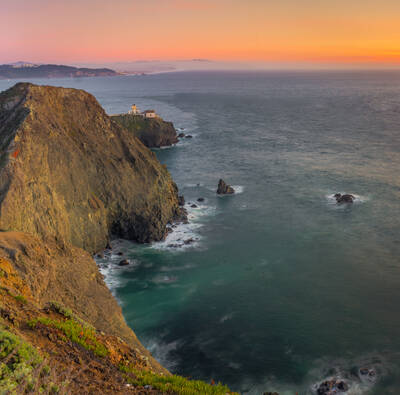 Photo of Point Bonita lighthouse. Sunset. Summer.