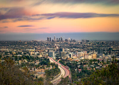 Photo of Los Angeles skyline from Jerome C. Daniel overlook in Holywood Hills. Sunset.