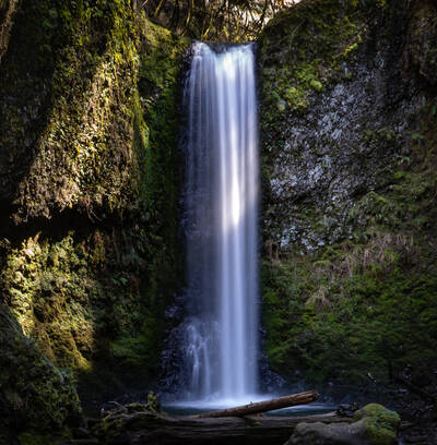 Photo of a small waterfall near Multnomah Falls. Columbia River gorge in Oregon. Winter.