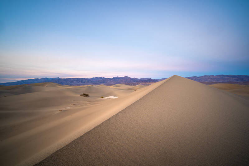 Photo of sand dunes in Death Valley National Park at sunset. Fall.