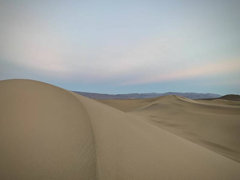 Photo of sand dunes in Death Valley National Park at sunset. Fall.