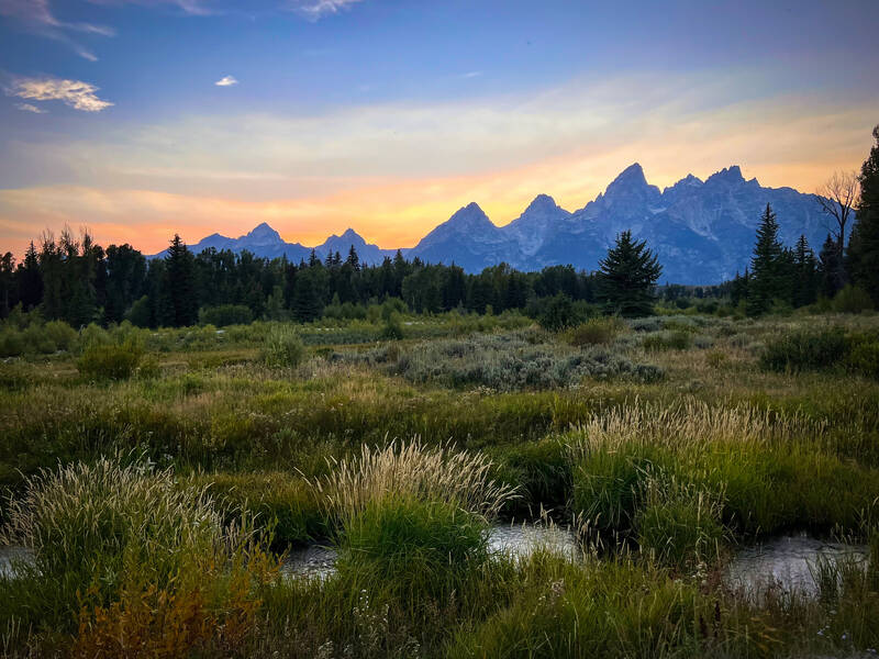 Photo of Grand Tetons from Schwabacker Landing. Summer.